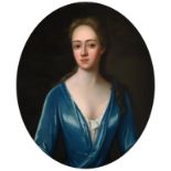 Circle of Michael Dahl (1653-1743) Portrait of an elegant lady, half length, wearing an aquamarine