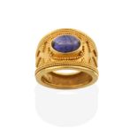 An Iolite Ring, possibly by Ilias Lalaounis, the central oval cabochon iolite in a yellow rubbed