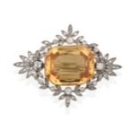 An Edwardian Diamond and Yellow Topaz Brooch, the rectangular cut yellow topaz in a yellow