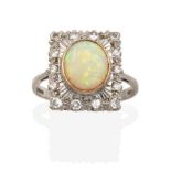 An 18 Carat White Gold Opal and Diamond Cluster Ring, the plaque set throughout with eight-cut