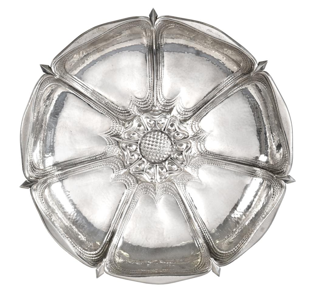 A George V Silver Centrepiece-Dish, by Omar Ramsden, London, 1930, in the form of a stylised Tudor