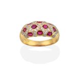 An 18 Carat Gold Synthetic Ruby and Diamond Ring, the domed top inset with oval cut synthetic rubies