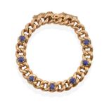 A Sapphire Bracelet, the yellow curb link bracelet with seven oval cut sapphires spaced evenly