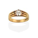 A Diamond Solitaire Ring, the old cut diamond in a yellow claw setting, to a grooved shoulder