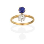 A Sapphire and Diamond Two Stone Ring, the old cut diamond in white claw settings and the cushion