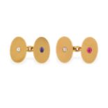 A Pair of Gem Set Cufflinks, the yellow chain linked oval plain polished plaques each inset with a