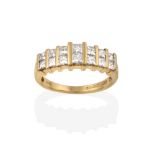 A 14 Carat Gold Diamond Half Hoop Ring, the two rows of graduated princess cut diamonds spaced by