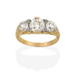 A Diamond Three Stone Ring, the graduated old cut diamonds with eight-cut diamond accents, in a