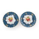 A pair of Royal Worcester dishes with a crimped edge, blue and gilt decoration with fruit 1925