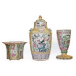 A 19th century Chinese yellow ground porcelain vase (cut down), painted with lotus scrolls, having