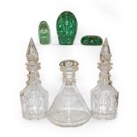 Three Victorian Sunderland dump paperweights, a pair of 20th century mallet form decanters and a