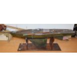 A large early 20th century painted wooden single masted pond yacht, 150cm long. No weighted keel