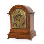 An oak striking mantel clock, early 20th century, movement backplate stamped W & H Sch, striking
