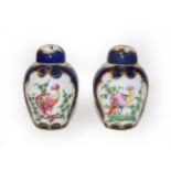 A pair of Sampson Worcester porcelain tea canisters with gilt highlighted decoration with exotic
