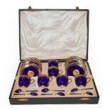A cased Royal Worcester cobalt blue and gilt highlighted coffee set comprising six cups and