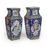 A pair of 19th century Chinese canton vases with peacocks, exotic and figures in panels