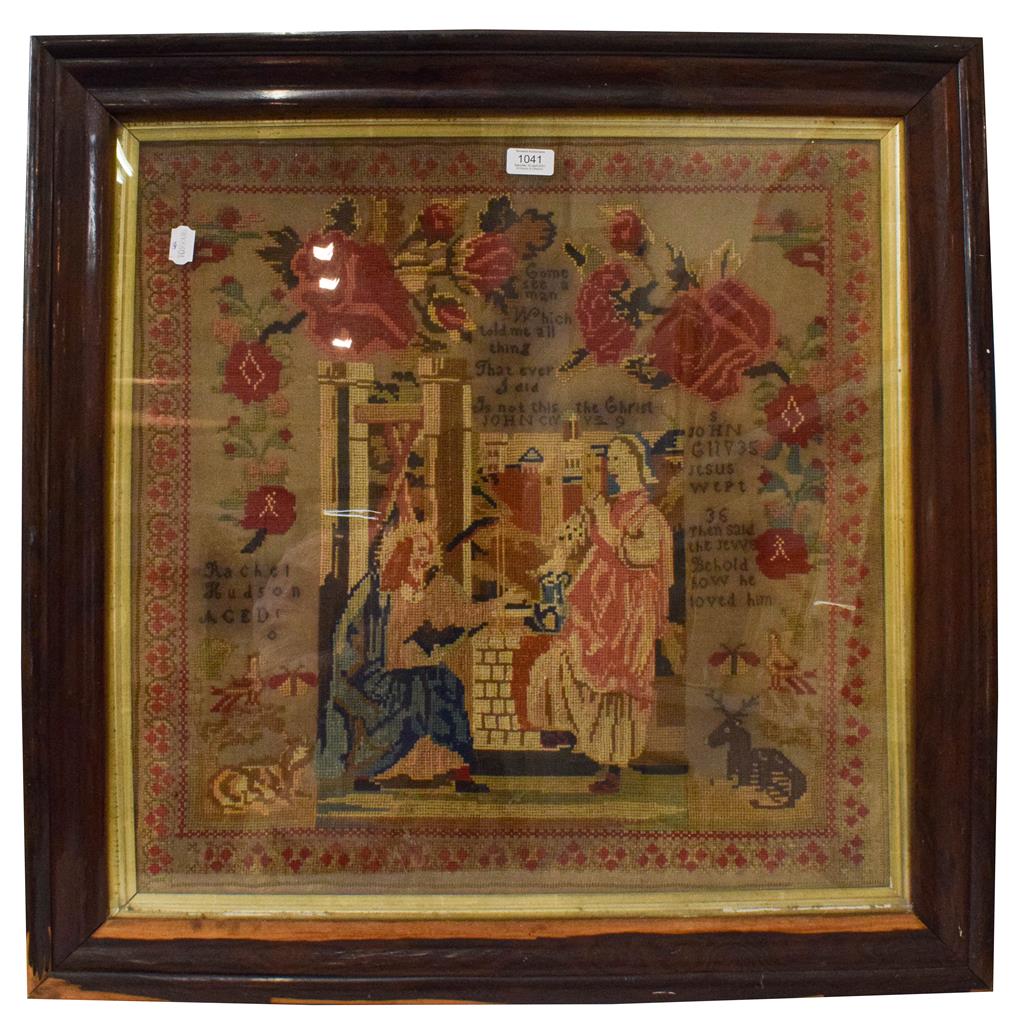 A large 19th century framed religious woolwork sampler worked by Rachel Hudson, decorated with