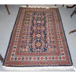 A good modern Azeri Perepedil design Rug, the indigo field with typical rams horn devices enclosed