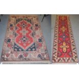 A Yagcibedir runner, 268cm by 70cm and another similar rug, 200cm by 122cm (2)