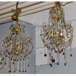 A pair of Venetian style three light lustre drop ceiling lights, 60cms drop