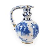 A Dated English Delft Puzzle Jug, London or Brislington, 1670, of ovoid form, the knopped pierced