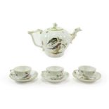 A Meissen Porcelain Tea Service, circa 1750, painted with birds in branches and with scattered