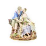 A Meissen Porcelain Figure Group, circa 1880, as a 18th century lovers sitting on a rocky outcrop,