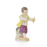 A Meissen Porcelain Figure of a Boy, late 19th/early 20th century, wearing 18th century costume