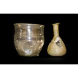 A Roman Glass Beaker, probably 4th century AD, with slightly everted rim and band of three lines and