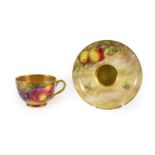 A Royal Worcester Porcelain Teacup and Saucer, 1952/53, painted with still lives of fruit on a mossy
