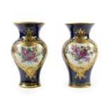 A Pair of Worcester Porcelain Vases, circa 1770, of baluster form with trumpet necks, painted with