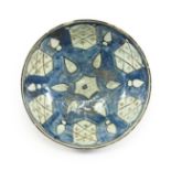 A Persian Earthenware Bowl, probably 17th/18th century, with pierced and glazed filled lattice