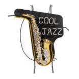 A Neon Display Sign, inscribed COOL JAZZ over a gilt and silvered composition saxophone on a black