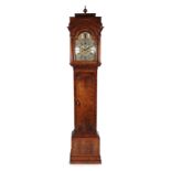 A Walnut Eight Day Longcase Clock, case with caddied pediment, glazed viewing side windows, arched