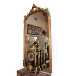 A Victorian Gilt and Gesso Overmantel Mirror, mid 19th century, the rectangular arched mirror