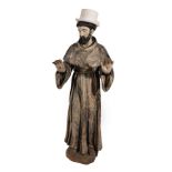 An Italian Polychrome Wooden Figure of St Francis of Assisi, 18th century, displaying the