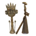 A Yoruba Large Figural Bell, the handle cast in bronzed as a tribesman, the bell of overlapped sheet