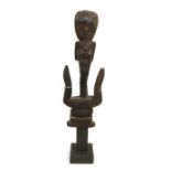 A 20th Century Dyak Hampatung/Fertility Post, Borneo, with Janus carved figure of a man and woman