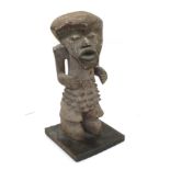 A Mid-20th Century Mambila Guardian Figure, Cameroon, with large rounded triangular head, the