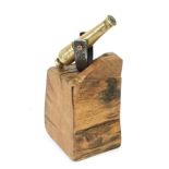 A Small Brass Desk Cannon, the 11cm barrel stamped with broad arrow/V R and mounted on an oak block,