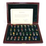 A Commemorative Set of Thirty Four Rhodesian Miniature Medals and Awards, twenty seven in solid