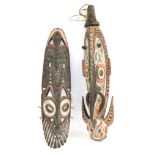 A Papua New Guinea Wood Gable Mask, carved as an elongated stylised boar's head with two pairs of