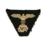 A German Third Reich Waffen SS Trapezoid Cap Insignia, the black wool field with cotton backing