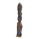 A Large Native American Indian Style Totem Pole, of red, blue, orange and yellow painted wood,