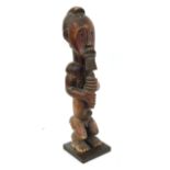 A 20th Century Southern Fang Male Reliquary Guardian Figure, Gabon, with block carved coiffure,