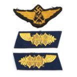 A German Third Reich Air Sea Rescue Cloth Insignia, the black cloth field embroidered with a