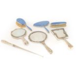 A Collection of Dressing-Table Items, comprising: a hand-mirror, hair-brush and clothes brush, by