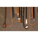 Two Indian white metal topped canes, other canes and walking sticks