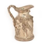 A Silvered Wine Jug, in the Regency style, heavily cast with Bacchic putto among fruiting