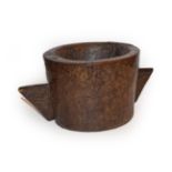An 18th century two handled wooden mortar